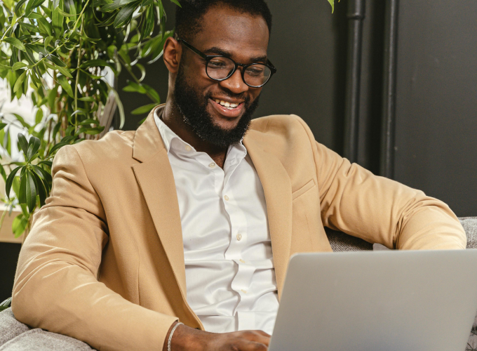 man typing on laptop